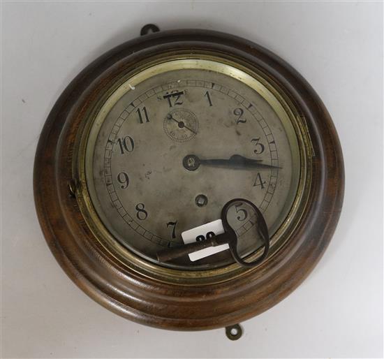 An oak cased wall clock